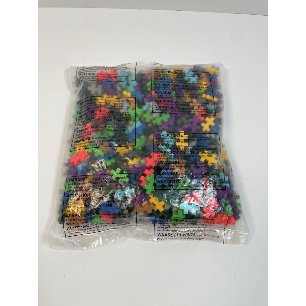 Multi-colored Mini Plus-Plus building blocks designed for interlocking play 3/4”